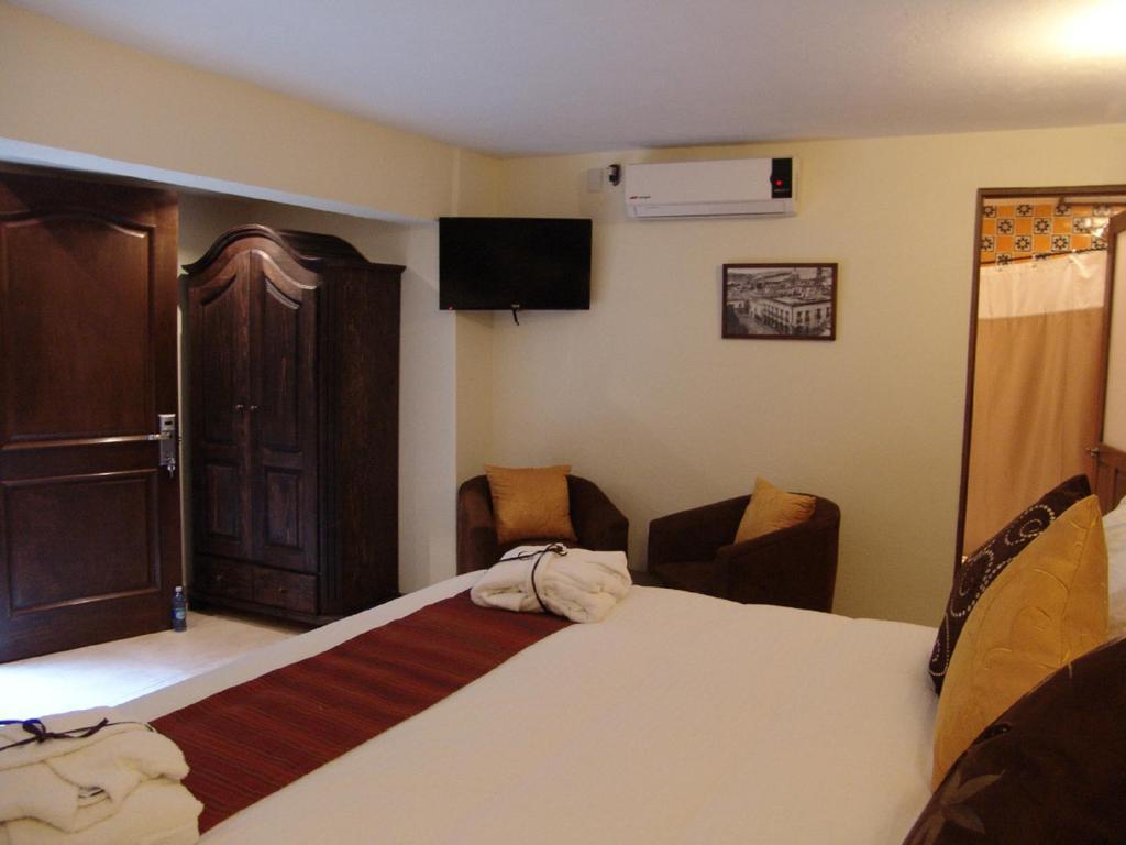Casa Del Tio Hotel Boutique San Miguel de Allende Ruang foto A room at the hotel